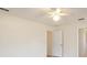 Spacious bedroom with ceiling fan and neutral walls at 10181 Sw 46 Ct, Ocala, FL 34476