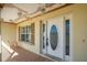 Front entrance with an oval-shaped door and tiled flooring at 10181 Sw 46 Ct, Ocala, FL 34476