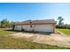 The property has a detached garage with a concrete driveway at 10181 Sw 46 Ct, Ocala, FL 34476