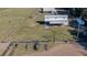 Aerial view of property showing barn, arena, and pasture at 2198 W Highway 329, Citra, FL 32113