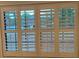 White plantation shutters on a window at 1915 Sw 34Th Court Ct, Ocala, FL 34474