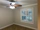 Bright bedroom with ceiling fan and window shutters at 1915 Sw 34Th Court Ct, Ocala, FL 34474