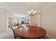 Round dining table with chairs in a well-lit dining room at 17846 Se 125Th Cir, Summerfield, FL 34491
