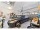 Attached garage with storage shelving and space for a car at 17846 Se 125Th Cir, Summerfield, FL 34491