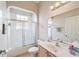 Clean bathroom with tub/shower combo, vanity with sink, and mirrored medicine cabinet at 17846 Se 125Th Cir, Summerfield, FL 34491