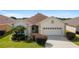 One-story home with 2-car garage and landscaped yard at 17846 Se 125Th Cir, Summerfield, FL 34491