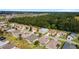 Aerial view of a residential community with houses, trees, and a golf course in the background at 17846 Se 125Th Cir, Summerfield, FL 34491