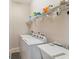Laundry room with washer, dryer, and shelving at 17846 Se 125Th Cir, Summerfield, FL 34491