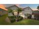 Single-story house with a two-car garage and manicured landscaping at 17846 Se 125Th Cir, Summerfield, FL 34491