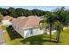 House back view showing the screened patio and backyard at 17846 Se 125Th Cir, Summerfield, FL 34491