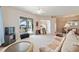 Living room with an open floor plan, views to the dining area and patio at 17846 Se 125Th Cir, Summerfield, FL 34491