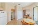 Bright kitchen with tile floor, laundry access, and breakfast nook at 17846 Se 125Th Cir, Summerfield, FL 34491