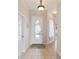 Bright entryway with tile floors and an oval-shaped door at 17846 Se 125Th Cir, Summerfield, FL 34491