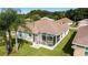 An aerial view of the house, highlighting the screened-in patio and backyard at 17846 Se 125Th Cir, Summerfield, FL 34491