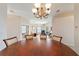 Round dining table with chairs in a well-lit dining room at 17846 Se 125Th Cir, Summerfield, FL 34491
