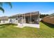 Spacious screened patio with seating area, perfect for outdoor relaxation at 17846 Se 125Th Cir, Summerfield, FL 34491