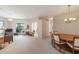 Bright living room with dining area, carpet, and access to a patio at 17846 Se 125Th Cir, Summerfield, FL 34491