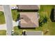 Bird's eye view of a single Gathering home with a brown roof and driveway at 17846 Se 125Th Cir, Summerfield, FL 34491