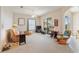 Living room with comfy seating, a fireplace, and access to a patio at 17846 Se 125Th Cir, Summerfield, FL 34491