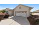 View of the two-car garage with driveway at 17846 Se 125Th Cir, Summerfield, FL 34491