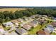 Aerial view of a residential area featuring numerous houses nestled amongst greenery at 17846 Se 125Th Cir, Summerfield, FL 34491