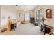 Living room with sliding glass doors, neutral decor, and ceiling fan at 17846 Se 125Th Cir, Summerfield, FL 34491