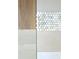 Close-up of bathroom tile samples, showcasing various textures and colors at 415 Se 1St Ave # 101-A, Ocala, FL 34471