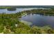 Aerial view showcasing the home's waterfront location and access to lake at 22649, 22645 And Tbd Ne 105Th Avenue Rd, Fort Mc Coy, FL 32134