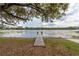 Picturesque wooden dock extending into a serene lake at 22649, 22645 And Tbd Ne 105Th Avenue Rd, Fort Mc Coy, FL 32134
