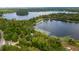 Aerial view of waterfront property with lush trees and a lake at 22649, 22645 And Tbd Ne 105Th Avenue Rd, Fort Mc Coy, FL 32134