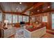 Living room features wood walls and ceiling, and a large TV at 22649, 22645 And Tbd Ne 105Th Avenue Rd, Fort Mc Coy, FL 32134