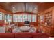 Spacious living room with wood walls and ceiling, and comfortable seating at 22649, 22645 And Tbd Ne 105Th Avenue Rd, Fort Mc Coy, FL 32134