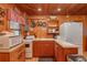 Cozy kitchen with wood cabinets and vintage appliances at 22649, 22645 And Tbd Ne 105Th Avenue Rd, Fort Mc Coy, FL 32134
