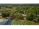 Aerial view of a secluded lakefront home nestled among the trees at 22649, 22645 And Tbd Ne 105Th Avenue Rd, Fort Mc Coy, FL 32134