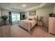 Spacious bedroom with a king-size bed and plenty of natural light at 7830 Sw 103Rd Loop, Ocala, FL 34476