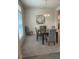 Bright dining room with a large table and comfortable seating at 7830 Sw 103Rd Loop, Ocala, FL 34476