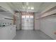 Laundry room with washer, dryer, and built-in shelving at 1618 Cypress Pt, Lady Lake, FL 32159