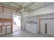 Bright laundry room with washer, dryer and storage at 1618 Cypress Pt, Lady Lake, FL 32159