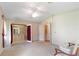 Bedroom with access to the bathroom and a seating area at 1618 Cypress Pt, Lady Lake, FL 32159