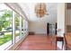 Spacious living room with wood floors and large windows at 1618 Cypress Pt, Lady Lake, FL 32159