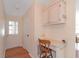 Small entryway with built-in desk and storage at 1618 Cypress Pt, Lady Lake, FL 32159