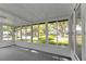 Sunroom with multiple windows and a view of the surrounding neighborhood at 1618 Cypress Pt, Lady Lake, FL 32159