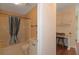 Bathroom with shower/tub combo and built-in desk at 1618 Cypress Pt, Lady Lake, FL 32159