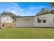 Detached garage with covered carport and ample space at 1618 Cypress Pt, Lady Lake, FL 32159