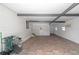 Spacious garage with tiled flooring and extra storage at 1618 Cypress Pt, Lady Lake, FL 32159