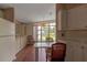 Bright dining area with view, wood floors, and chandelier at 1618 Cypress Pt, Lady Lake, FL 32159