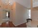 A long hallway with wood flooring and access to other rooms at 1618 Cypress Pt, Lady Lake, FL 32159