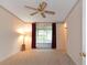 Spacious bedroom with sliding glass doors leading to a patio at 1618 Cypress Pt, Lady Lake, FL 32159
