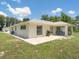House exterior with a patio, and grassy area at 16290 Sw 17Th Ave, Ocala, FL 34473