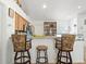 Kitchen with breakfast bar and wood cabinets at 16290 Sw 17Th Ave, Ocala, FL 34473